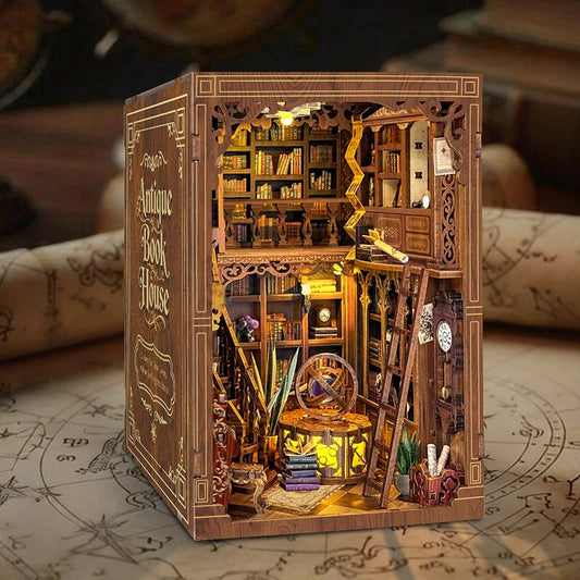 Myriad Books House DIY book nook kit displayed between books on a shelf